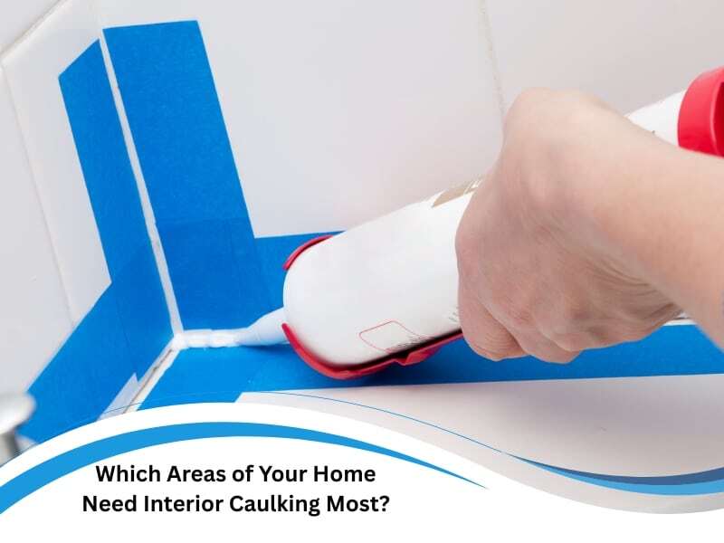 Using interior caulking in bathroom corners with blue tape for precise sealing.